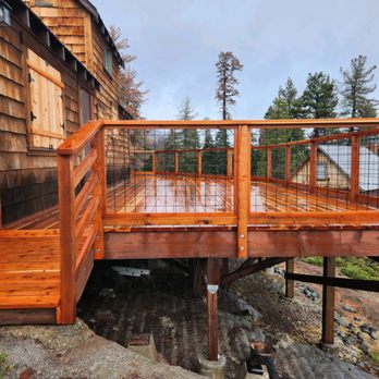 Ogden Construction - a view of a wooden deck - General Contractors Near Me