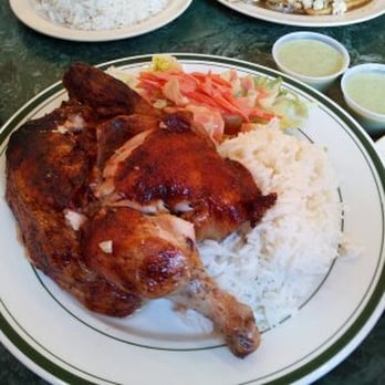 Caravan Chicken - 1/2 Chicken with white rice and salad. Look how crispy the skin is!! - Latin American Near Me - Astoria, New York Caravan Chicken - 1/2 Chicken with white rice and salad. Look how crispy the skin is!! - Latin American Near Me - Astoria, New York