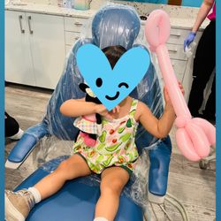 Hello Smiles Pediatric Dentistry - Happy with her giraffe animal balloon