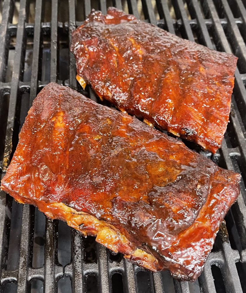 Pink Heifer Saloon and Smokehouse Logo