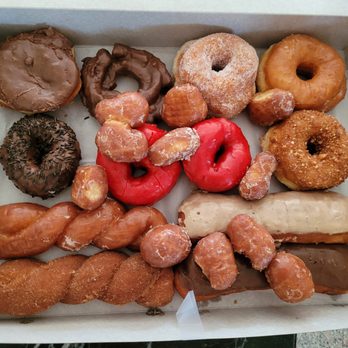 Goody's Donuts - Top L to R: Choco, choco cake, sugar, glazed, choco sprinkles, strawberry glaze, cinnamon crumb, glaze twist, maple & choco bar, donut holes - Donuts Near Me - Cerritos, California