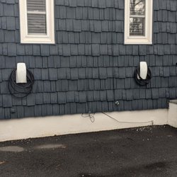 RF Electric - Two Tesla Wall Connectors outside with load sharing