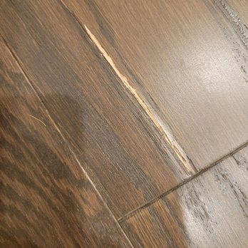 Columbia Floors - Large chip out of the floor after the first day - Carpeting Near Me - Columbia, Maryland