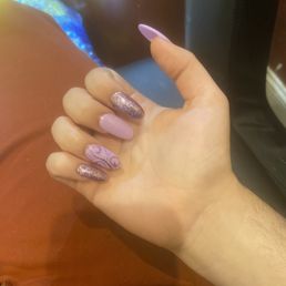 Full Set Acrylic nail; all crooked, and I asked for flowers on my mail not whatever that was. Very unhappy.
