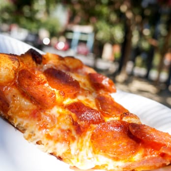 Village Bakery - pepperoni slice in the sun. - Bakeries Near Me - Davis, California Village Bakery - pepperoni slice in the sun. - Bakeries Near Me - Davis, California