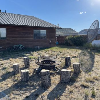 Boulder Motel - Campfire ring and firewood out back (room 8 window at the end in the background) - Hotels Near Me - Boulder, Wyoming Boulder Motel - Campfire ring and firewood out back (room 8 window at the end in the background) - Hotels Near Me - Boulder, Wyoming