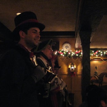 Five Crowns - Carolers, front dining room - Steakhouses Near Me - Corona del Mar, California Five Crowns - Carolers, front dining room - Steakhouses Near Me - Corona del Mar, California