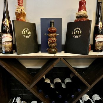 Lagar Restaurant - bottles of wine on a wine rack - Portuguese Near Me - Union, New Jersey Lagar Restaurant - bottles of wine on a wine rack - Portuguese Near Me - Union, New Jersey