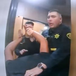 Officer man handles women after she is assaulted by another person in court room