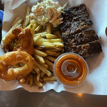 Phil's BBQ - Small Pork Rib Tickler with fries, onion rings, and coleslaw. Sauce on the side. - Barbeque Near Me - San Diego, California Phil's BBQ - Small Pork Rib Tickler with fries, onion rings, and coleslaw. Sauce on the side. - Barbeque Near Me - San Diego, California