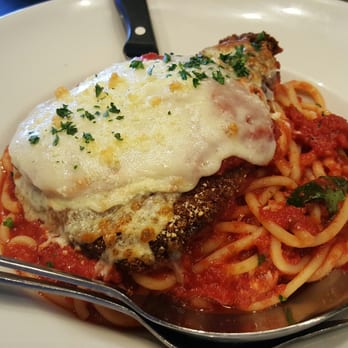 Pizza Rock - Chicken parmigiana- breaded chicken breast, mozzarella, provolone, and pecorino-romano, served over buccatini pomodoro. - Pizza Near Me - Henderson, Nevada Pizza Rock - Chicken parmigiana- breaded chicken breast, mozzarella, provolone, and pecorino-romano, served over buccatini pomodoro. - Pizza Near Me - Henderson, Nevada