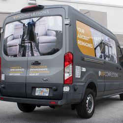 Unlimited Wraps - Commercial Wrap in Avery Matte GunMetal with full color images in gloss finish on Ford Transit
