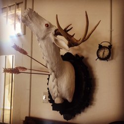 Hair by Jo - Savage art in the waiting area.  Sculpture by Daphne Loney