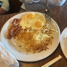 Hash browns eggs sunny up and bacon with crepes Hash browns eggs sunny up and bacon with crepes