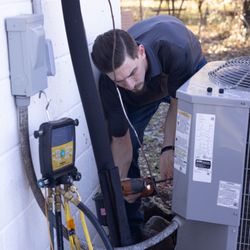 Integrity Heating & Air - One of our service technicians prepares to perform maintenance.