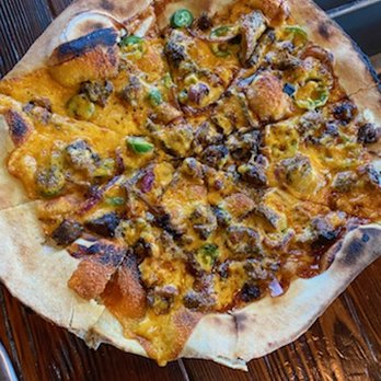 Sterling Pig Brewery - Pitmaster pizza - Fiery and smoky, made with chopped brisket, onions, jalepenos, smoked cheddar, and BBQ sauce. - Breweries Near Me - Media, Pennsylvania Sterling Pig Brewery - Pitmaster pizza - Fiery and smoky, made with chopped brisket, onions, jalepenos, smoked cheddar, and BBQ sauce. - Breweries Near Me - Media, Pennsylvania
