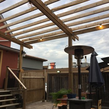 Potato Jackets - a patio with a table and chairs - Halal Near Me - Niagara Falls, Ontario Potato Jackets - a patio with a table and chairs - Halal Near Me - Niagara Falls, Ontario