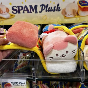 ABC Stores - a person holding a stuffed animal - Convenience Stores Near Me - Honolulu, Hawaii