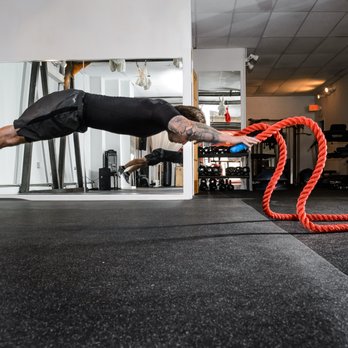 American Muscle Studios - Personal Trainer Casey taking workouts to new heights...literally. - Yoga Near Me - Riverhead, New York American Muscle Studios - Personal Trainer Casey taking workouts to new heights...literally. - Yoga Near Me - Riverhead, New York