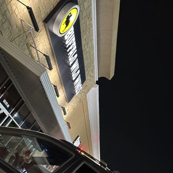 Buffalo Wild Wings - a car parked in front of a building - Chicken Wings Near Me - Webster, Texas