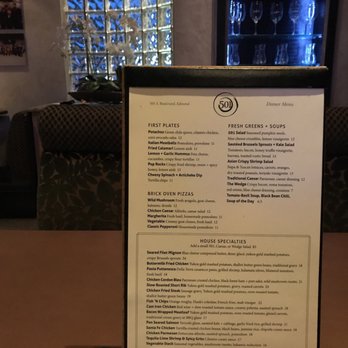 Cafe 501 - Seasonal menu with seating next to Perfectly dimmed light next to fully bloomed orchids! - Breakfast & Brunch Near Me - Edmond, Oklahoma