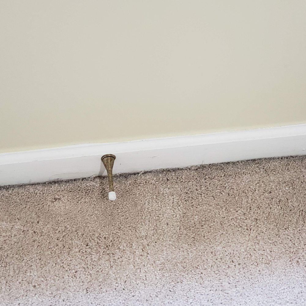 Boomtown - Dirt pushed to outer edges of carpet - Property Management Near Me - Frederick, Maryland