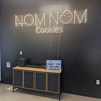 Nom Nom Cookies - a neon sign on a wall - Desserts Near Me - Hurricane, Utah Nom Nom Cookies - a neon sign on a wall - Desserts Near Me - Hurricane, Utah