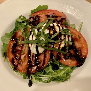 De La Torre's Trattoria - sliced tomatoes with arugula and burrata - Italian Near Me - Pleasanton, California De La Torre's Trattoria - sliced tomatoes with arugula and burrata - Italian Near Me - Pleasanton, California