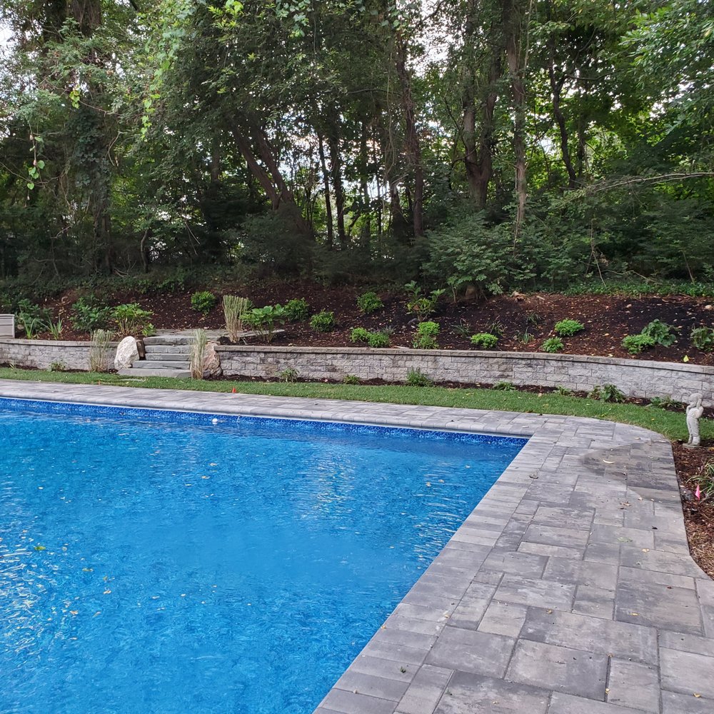 Kelly Brothers Landscaping - a pool in the backyard - Landscaping Near Me - Coram, New York