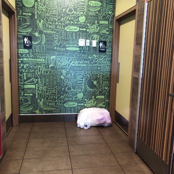 McDonald's - Women's restroom entrance, with trash just outside the door. - Coffee & Tea Near Me - Dublin, Georgia