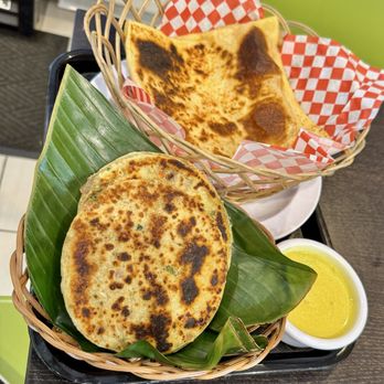 Rice N' Spice - Coconut Roti (Pol Roti) with coconut curry gravy (kiri hodi) and egg Godamba Roti. - Sri Lankan Near Me - Anaheim, California Rice N' Spice - Coconut Roti (Pol Roti) with coconut curry gravy (kiri hodi) and egg Godamba Roti. - Sri Lankan Near Me - Anaheim, California