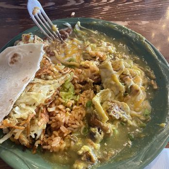 MartAnne's - we dug through this entire plate of chilaquiles and struggled to find any semblance of chips. soggy mess of burnt egg. - Breakfast & Brunch Near Me - Flagstaff, Arizona