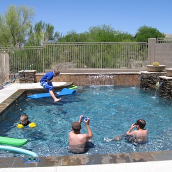 Big Daddy Construction & Design - a family playing in a pool - General Contractors Near Me - Scottsdale, Arizona Big Daddy Construction & Design - a family playing in a pool - General Contractors Near Me - Scottsdale, Arizona
