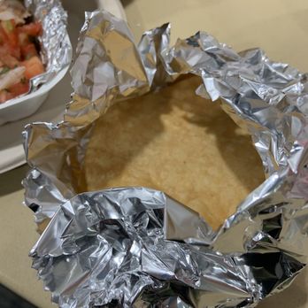 Señor Villa - a plate of food wrapped in aluminum foil - Mexican Near Me - Seattle, Washington