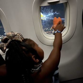 Spirit Airlines - Look how thought the window was hers - Airlines Near Me - Houston, Texas