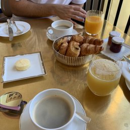 Coffee, juice, and hot flakey pastries Coffee, juice, and hot flakey pastries