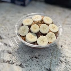 Juggling Juices and Bowls - A simple, yet delicious M.C. bowl. It comes with acai base, no honey, granola, nutella, peanut butter, and bananas!