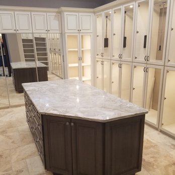 Eco Construction Group - a large kitchen island with a marble countertop - General Contractors Near Me - Mount Dora, Florida Eco Construction Group - a large kitchen island with a marble countertop - General Contractors Near Me - Mount Dora, Florida