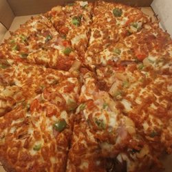 Pasha's Pizza & Indian Food - The "House Special" - mushroom, pepperoni, ham, onion, tomato, green pepper, and pineapple.