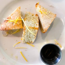Maximillians Grill & Wine Bar  - Garlic bread with lemon zest and olive oil with herbs and basalmic vinegar