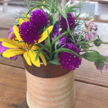 Red Wagon BBQ - Cute floral arrangements on the table! - Barbeque Near Me - Waco, Texas