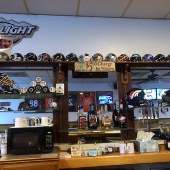 Just Bill's - a bar with helmets on the wall - Bars Near Me - Aurora, Colorado