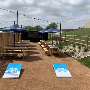 Golden Light Beer & Wine Garden - cornholes with blue umbrellas - Burgers Near Me - Amarillo, Texas Golden Light Beer & Wine Garden - cornholes with blue umbrellas - Burgers Near Me - Amarillo, Texas
