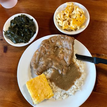 Shut Em Down Authentic Southern Restaurant - Smothered pork chop with collard greens and Mac & cheese - Southern Near Me - Jacksonville, Florida