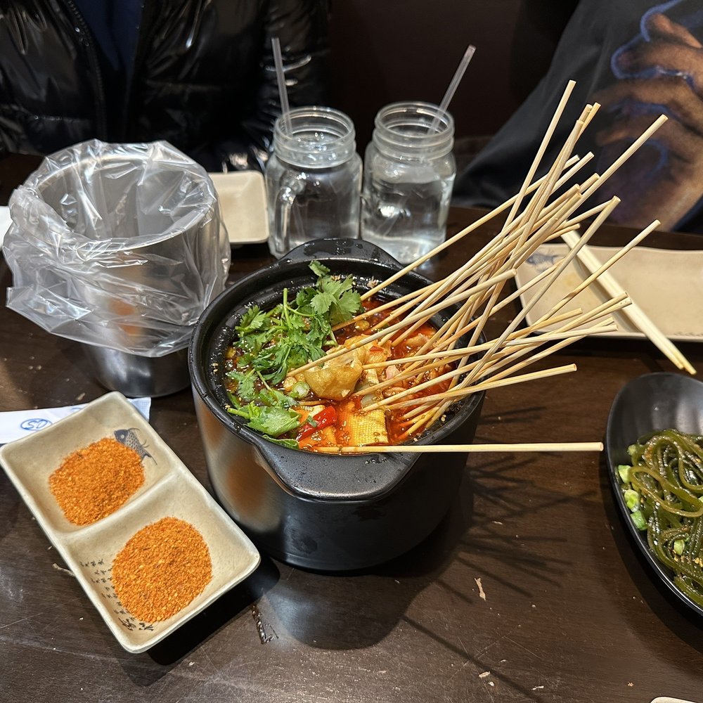 Mala Town - a table with a variety of food items - Szechuan Near Me - Brooklyn, New York Mala Town - a table with a variety of food items - Szechuan Near Me - Brooklyn, New York