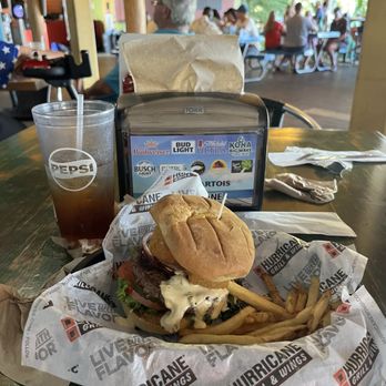 Hurricane Dockside Grill - The McDaddy burger-- bacon and puffed up cheese and the usual pickle - yum - American Near Me - Tavares, Florida Hurricane Dockside Grill - The McDaddy burger-- bacon and puffed up cheese and the usual pickle - yum - American Near Me - Tavares, Florida