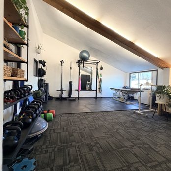 Empower PT - Upstairs office: kettle bells, balance tools, cable column, water bags, squat rack, landmine. Hi-lo table for spinal manipulation - Physical Therapy Near Me - Bellingham, Washington Empower PT - Upstairs office: kettle bells, balance tools, cable column, water bags, squat rack, landmine. Hi-lo table for spinal manipulation - Physical Therapy Near Me - Bellingham, Washington