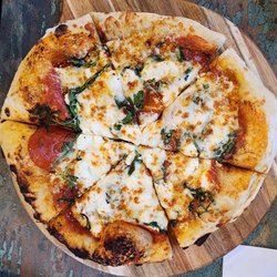 County Line Wood-Fired Pizza - Goat cheese, arugula and pepperoni pizza
