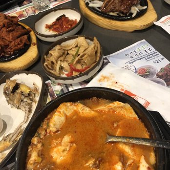 BCD Tofu House - Beef tofu soup (level spicy) with all the side dishes - Korean Near Me - Irvine, California
