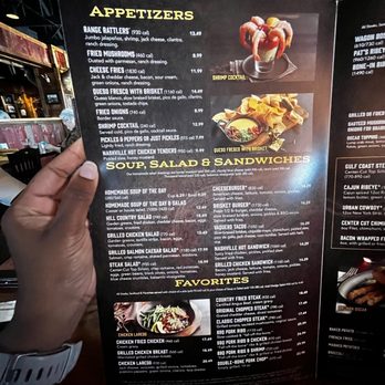 Saltgrass Steak House - a hand holding a menu - Steakhouses Near Me - Knightdale, North Carolina Saltgrass Steak House - a hand holding a menu - Steakhouses Near Me - Knightdale, North Carolina